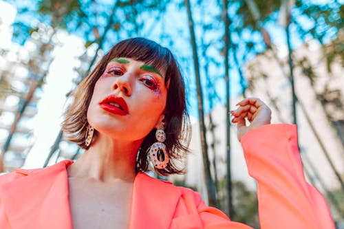 Portrait of a Woman with Red Lips Wearing a Pink Blazer