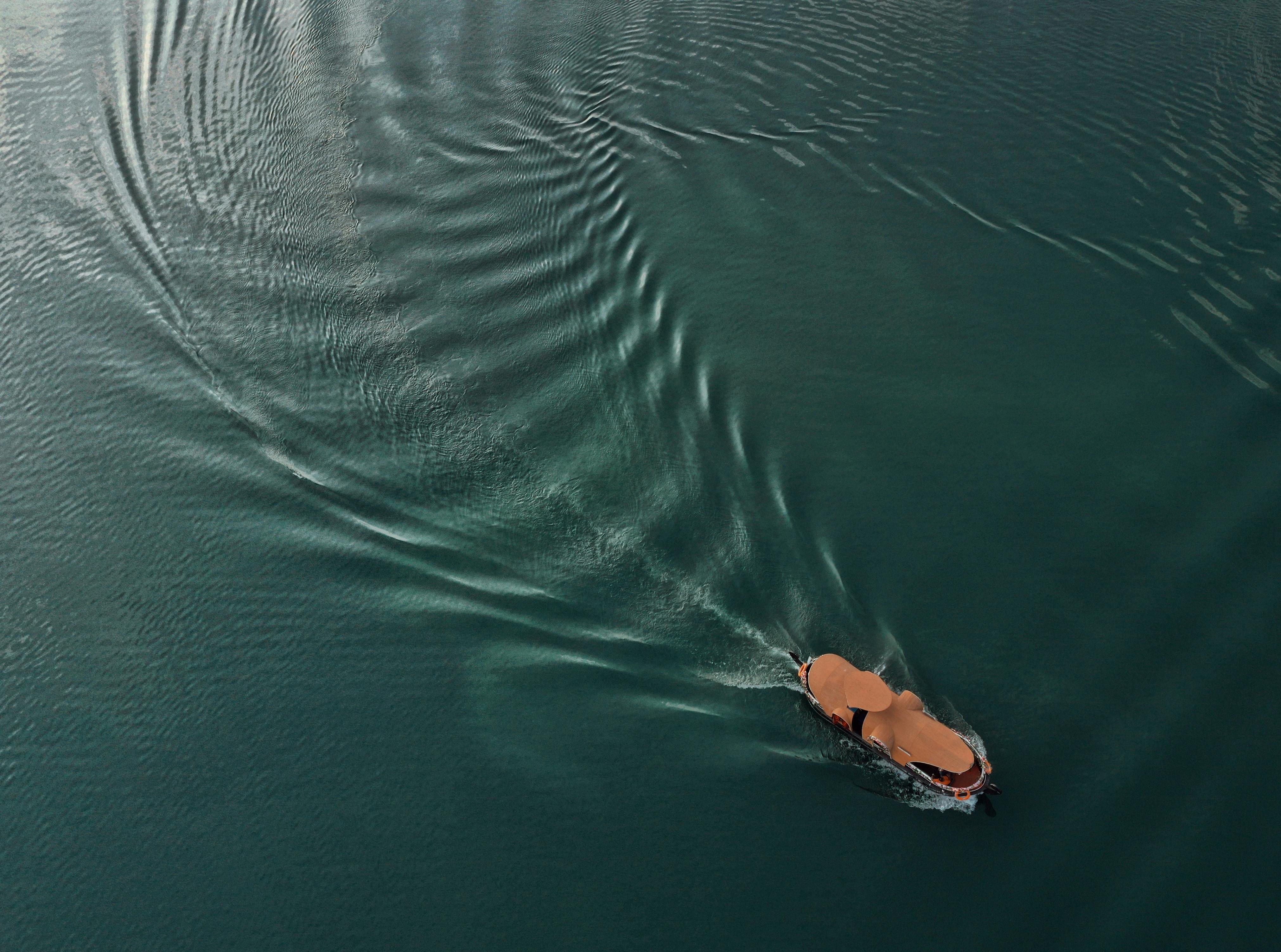 boat floating on rippled sea water
