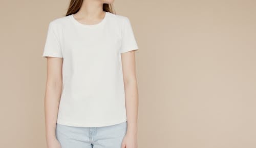Young Woman In White Crew Neck T-Shirt and Light Denim Jeans