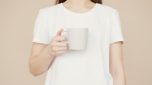 A Person Holding a Cup