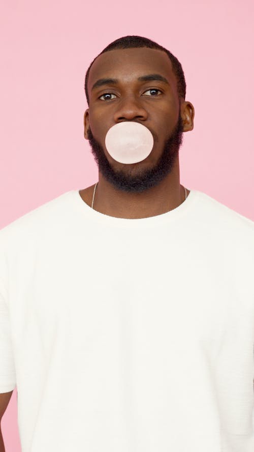 Free Man Blowing a Bubble Gum  Stock Photo