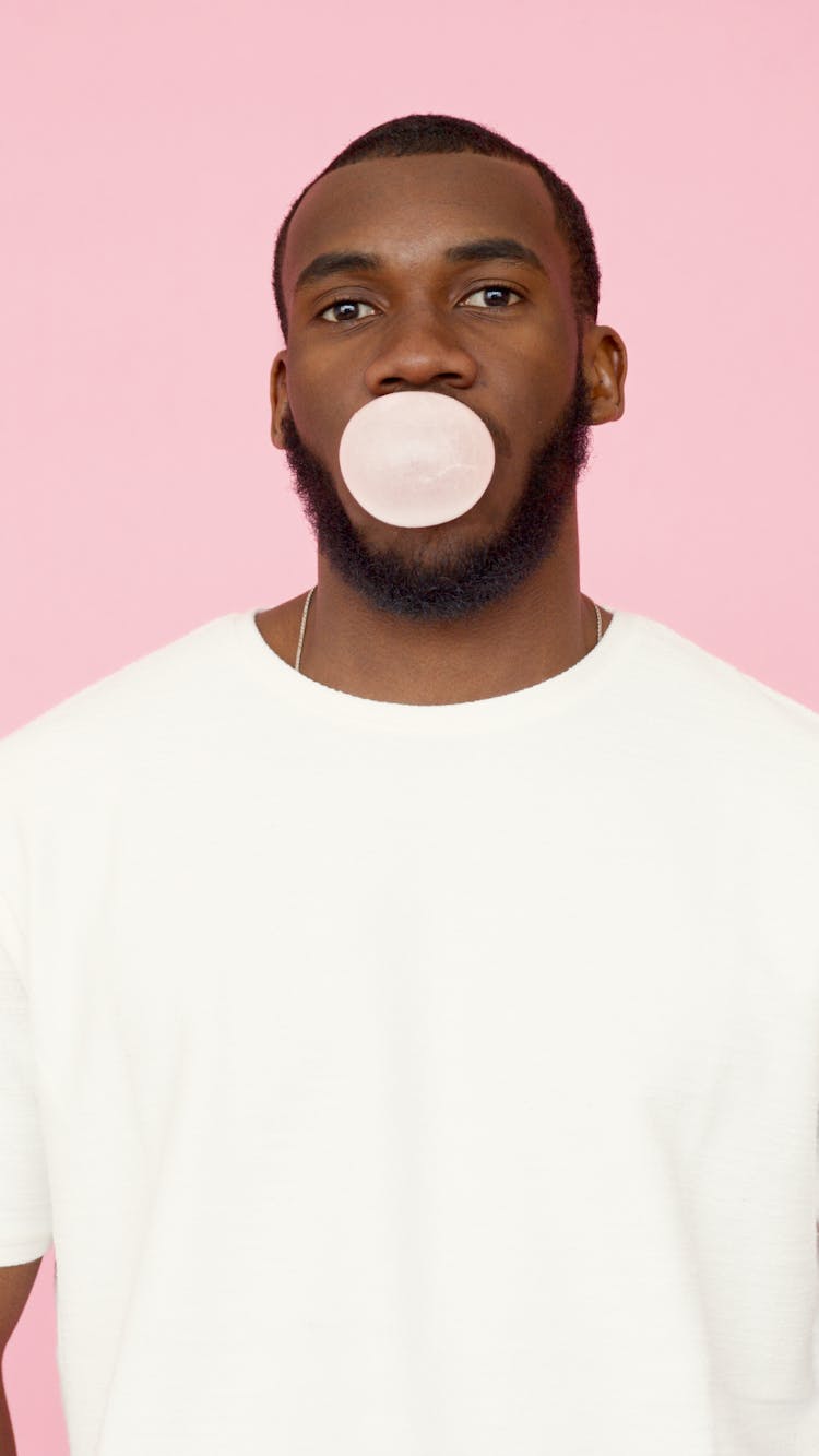 Man Blowing A Bubble Gum 