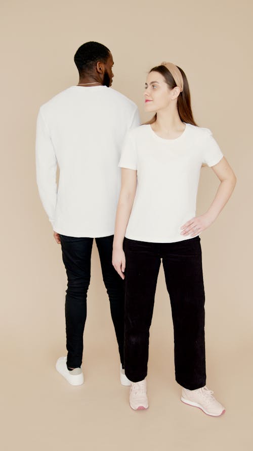 Man and Woman in White Top and Black Pants
