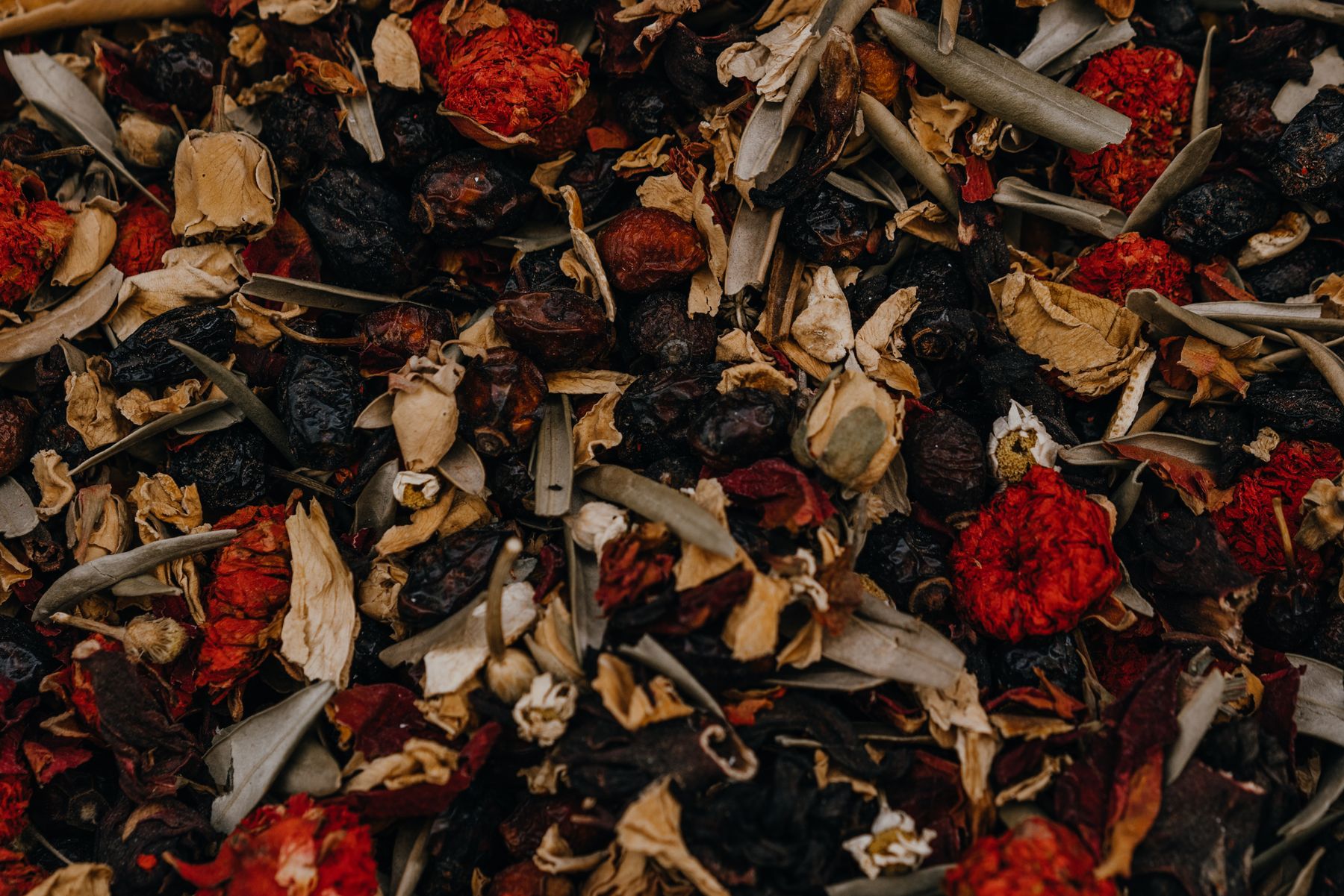 Dried fruits, flowers, and leaves for an herbal blend Dried fruits, flowers, and leaves for an herbal blend