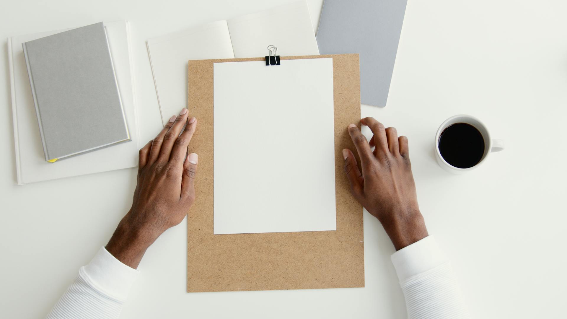 Person Holding White Printer Paper