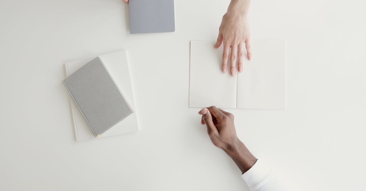 Person Handing A White Paper To Another Person · Free Stock Photo