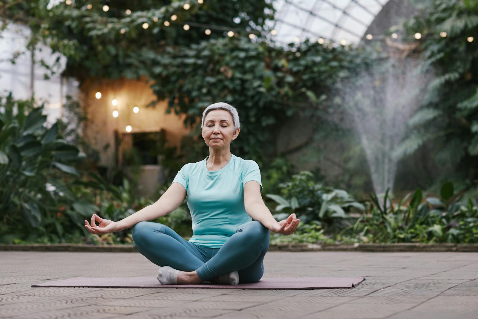 An elderly lady meditating to help with dementia