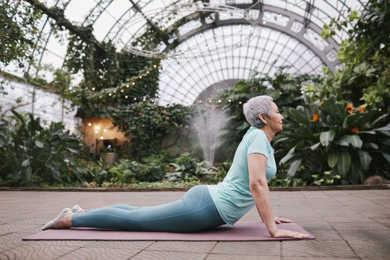 Woman doing cobra pose backbend