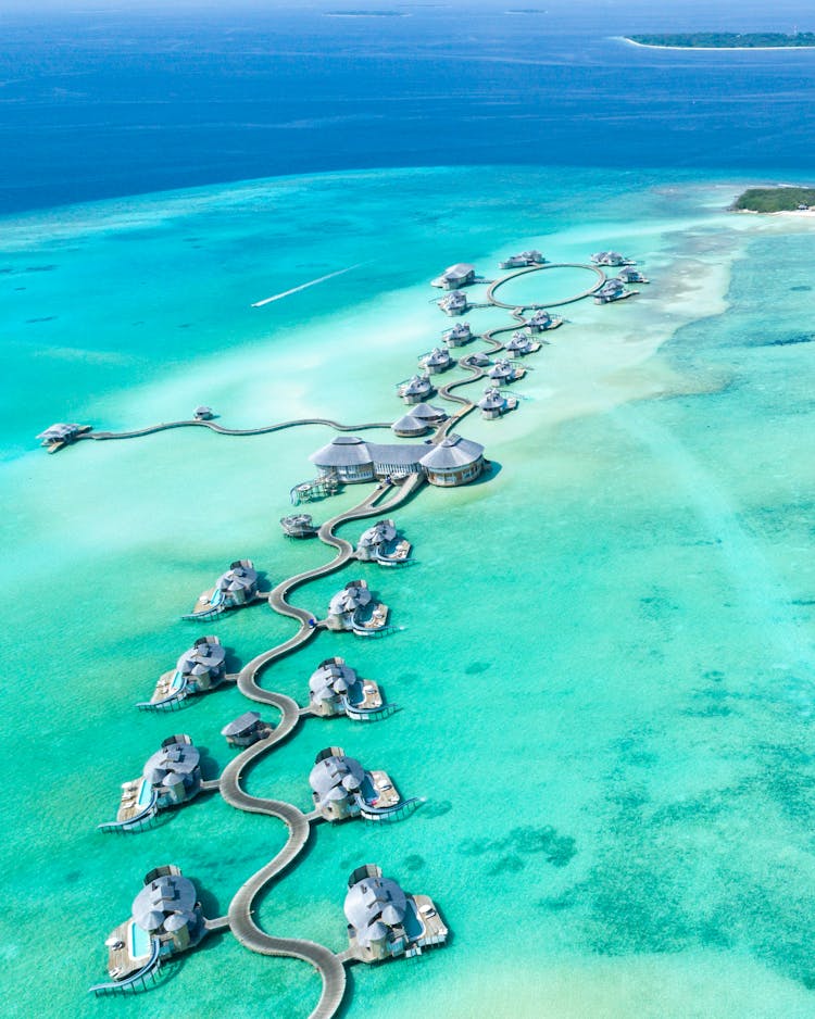 Aerial Photography Of Island With Cottages Surrounded With Water