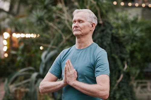 Free Man Practicing Yoga Stock Photo