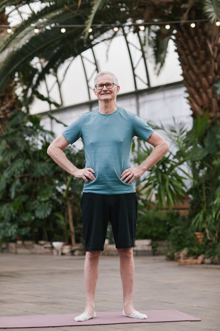 Man Standing On A Yoga Mat