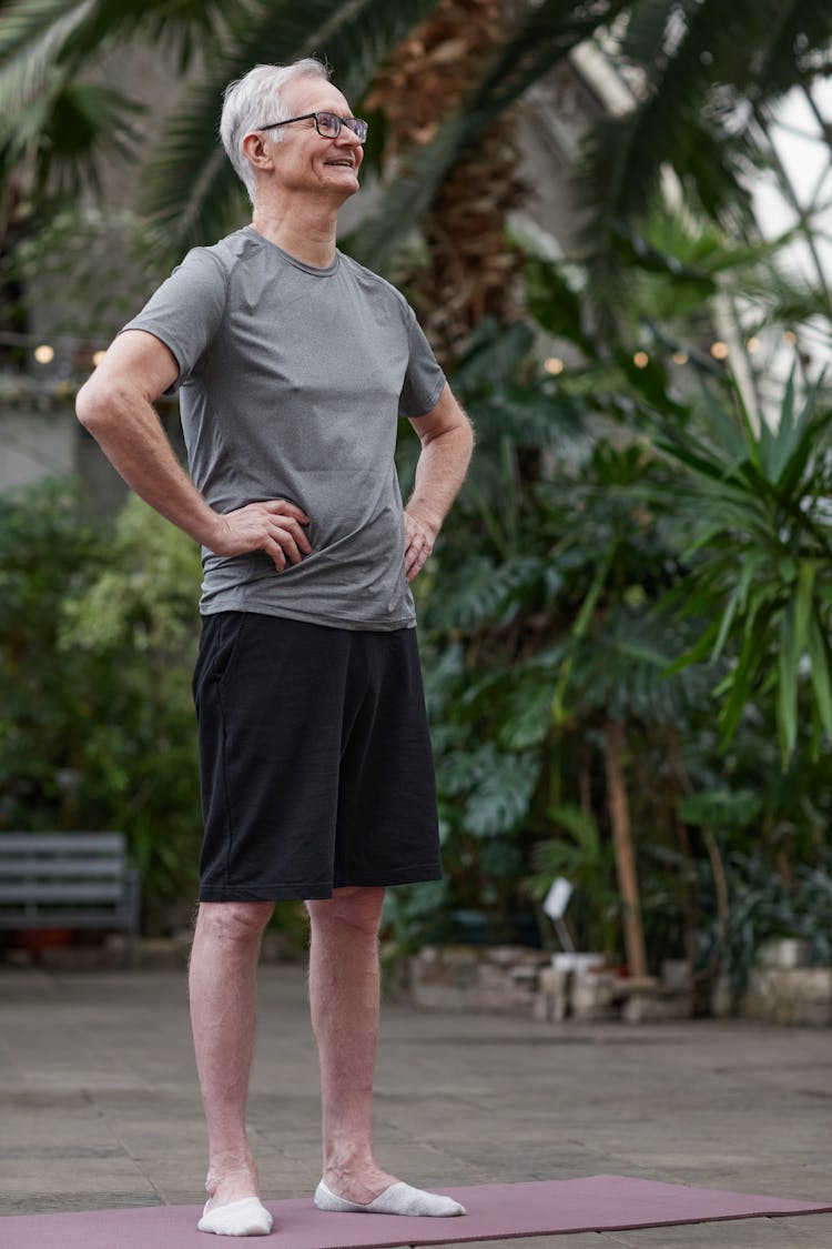 Man Standing On A Yoga Mat