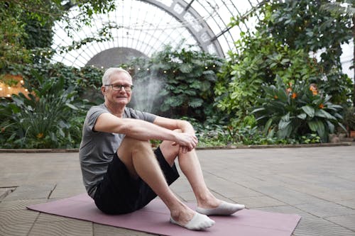 Man Sitting on Yoga Mat