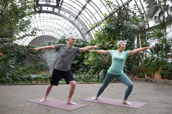 senior couple enjoying yoga together