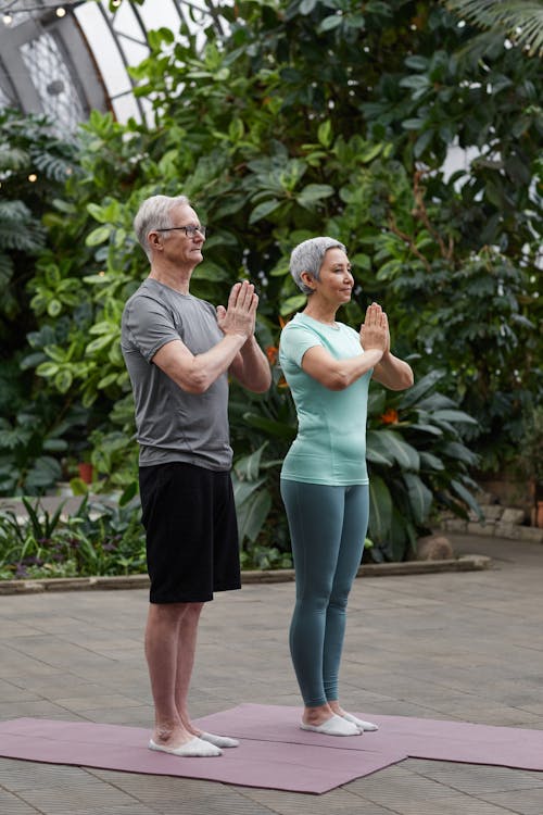 Free Couple Practicing Yoga Stock Photo