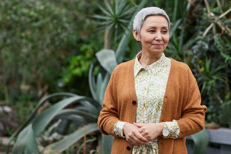 Woman In Brown Cardigan Smiling