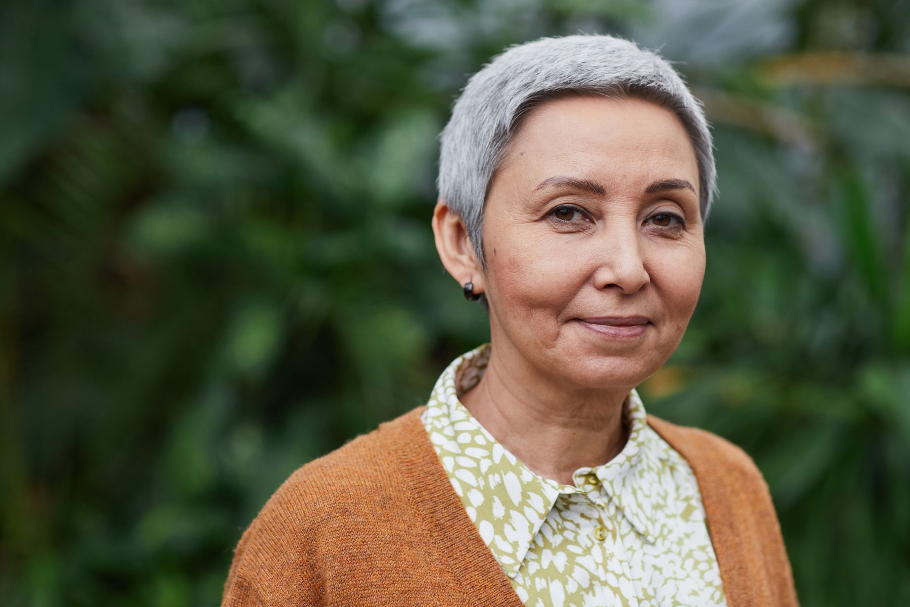 Mature Asian woman showing natural facial lines and skin texture