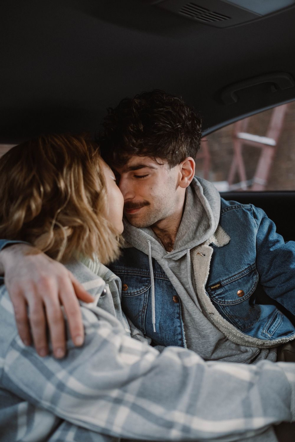 Car Cuddle Man and Woman Cuddle on Car Backseat · Free Stock Photo