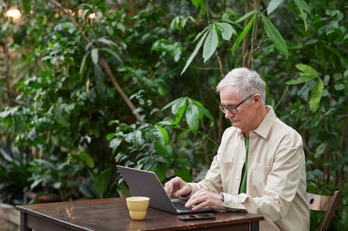 Man Busy Using His Laptop