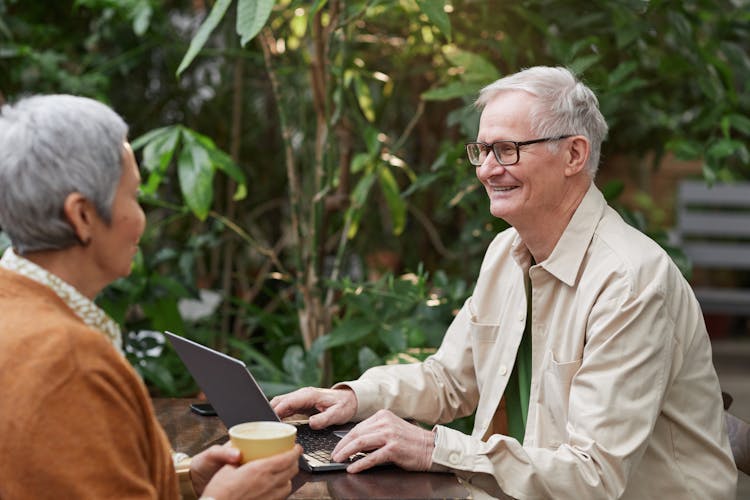 Man Smiling While Looking At Her Woman