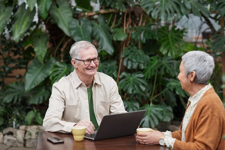 Lovely Couple Smiling While Looking At Each Other