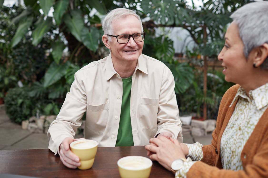 Elderly people drinking coffee
