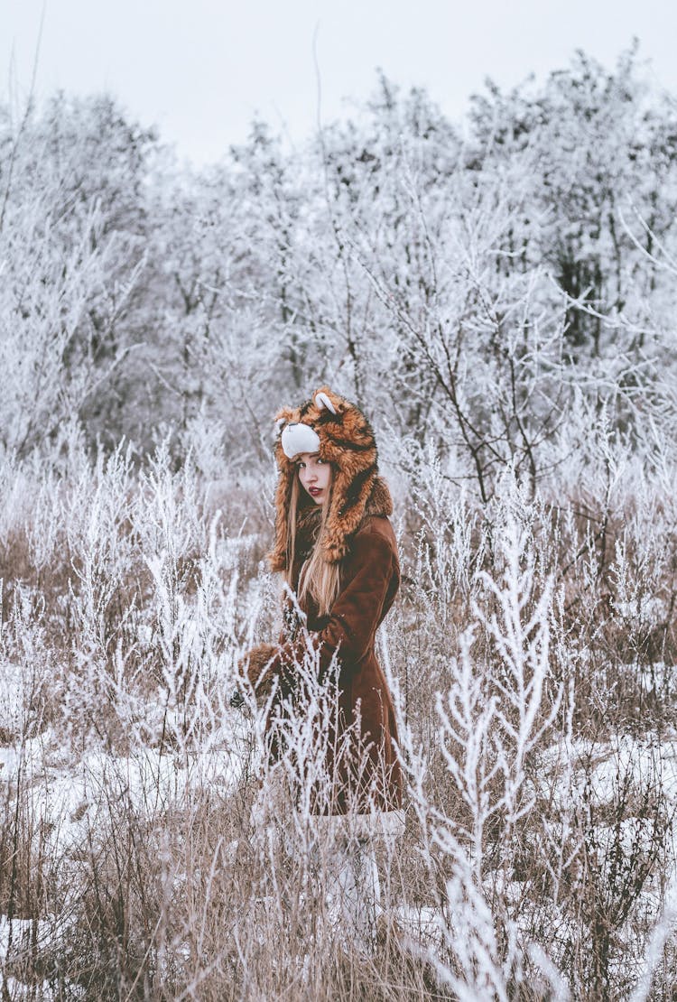 Serene Woman In Winter Clothes Walking In Cold Weather