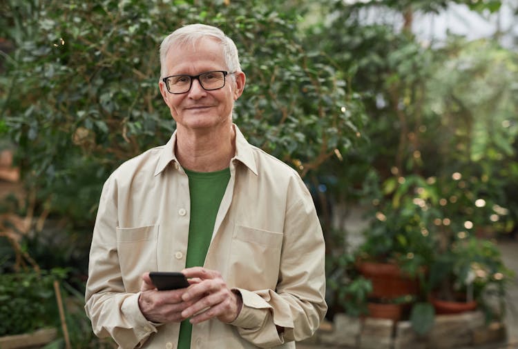 Smiling Man Wearing An Eyeglasses While Looking At The Camera