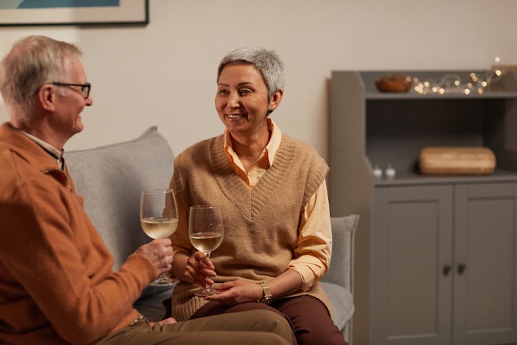 Lovely Couple Smiling While Looking At Each Other