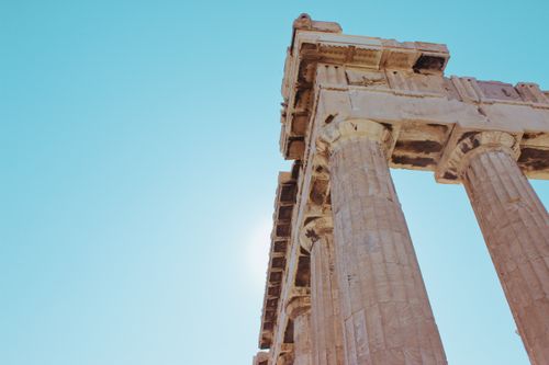 Free Low-angle view of the iconic Parthenon columns in Athens, Greece, under a clear sky. Stock Photo