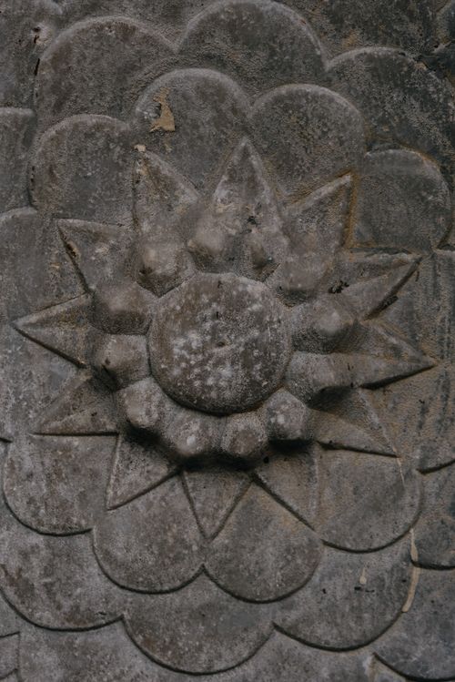 Free Intricate stone flower carving close-up, showcasing detailed texture. Stock Photo