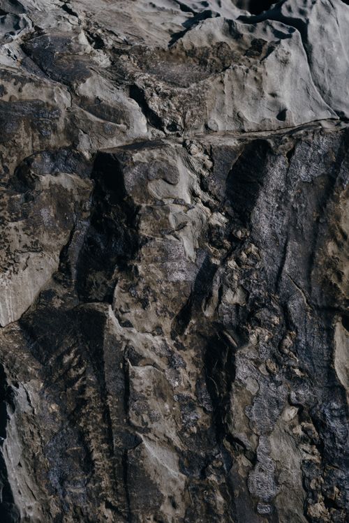 Free Detailed view of weathered rock texture highlighting intricate natural patterns. Stock Photo