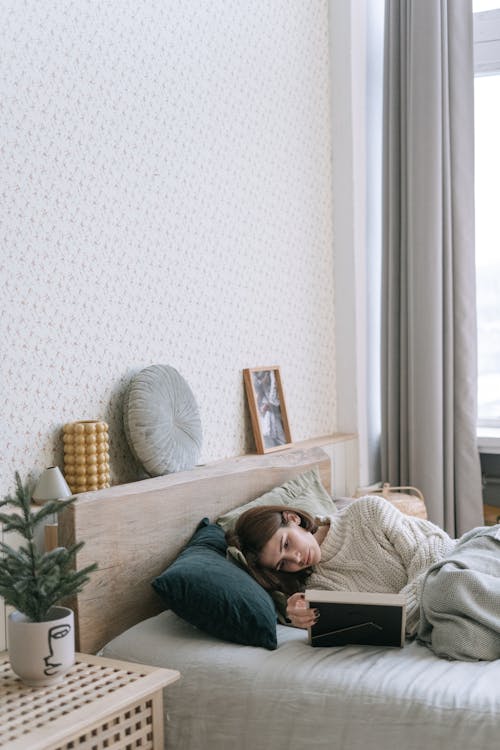 A Woman Lying Down on a Bed