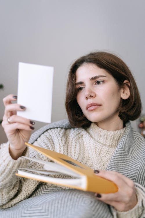 A Woman Looking at a Photo