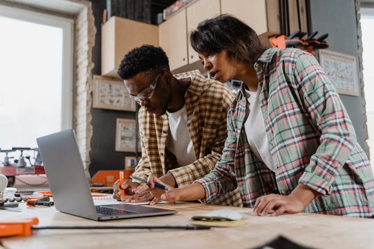 A Man And Woman Doing Carpentry