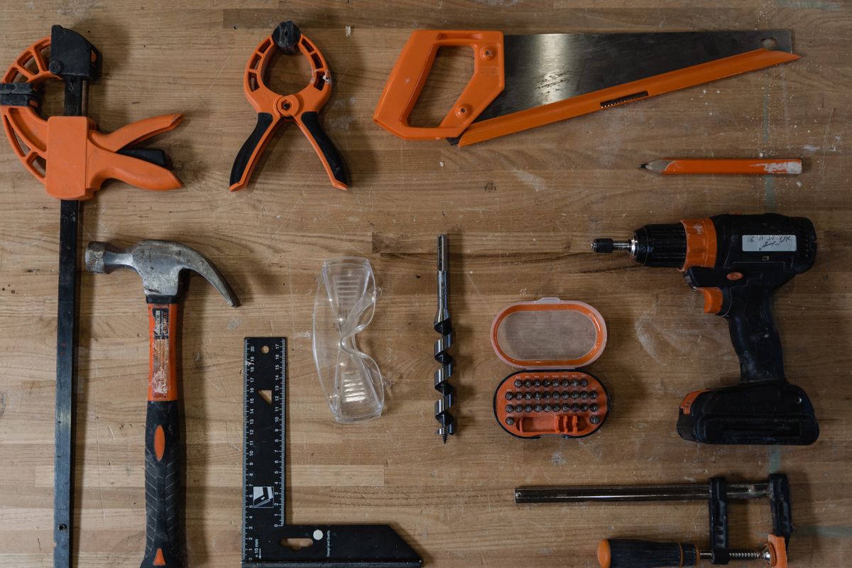 Carpentry tools arranged on a wooden workbench