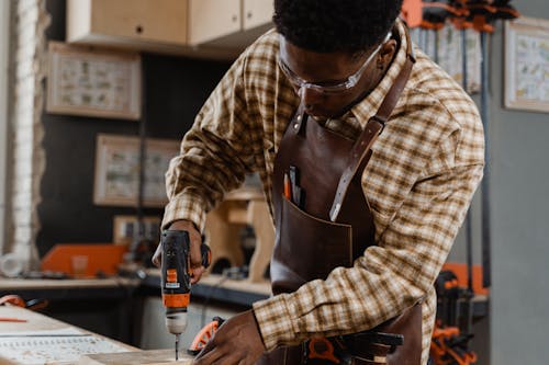Free A Man Doing Carpentry Stock Photo