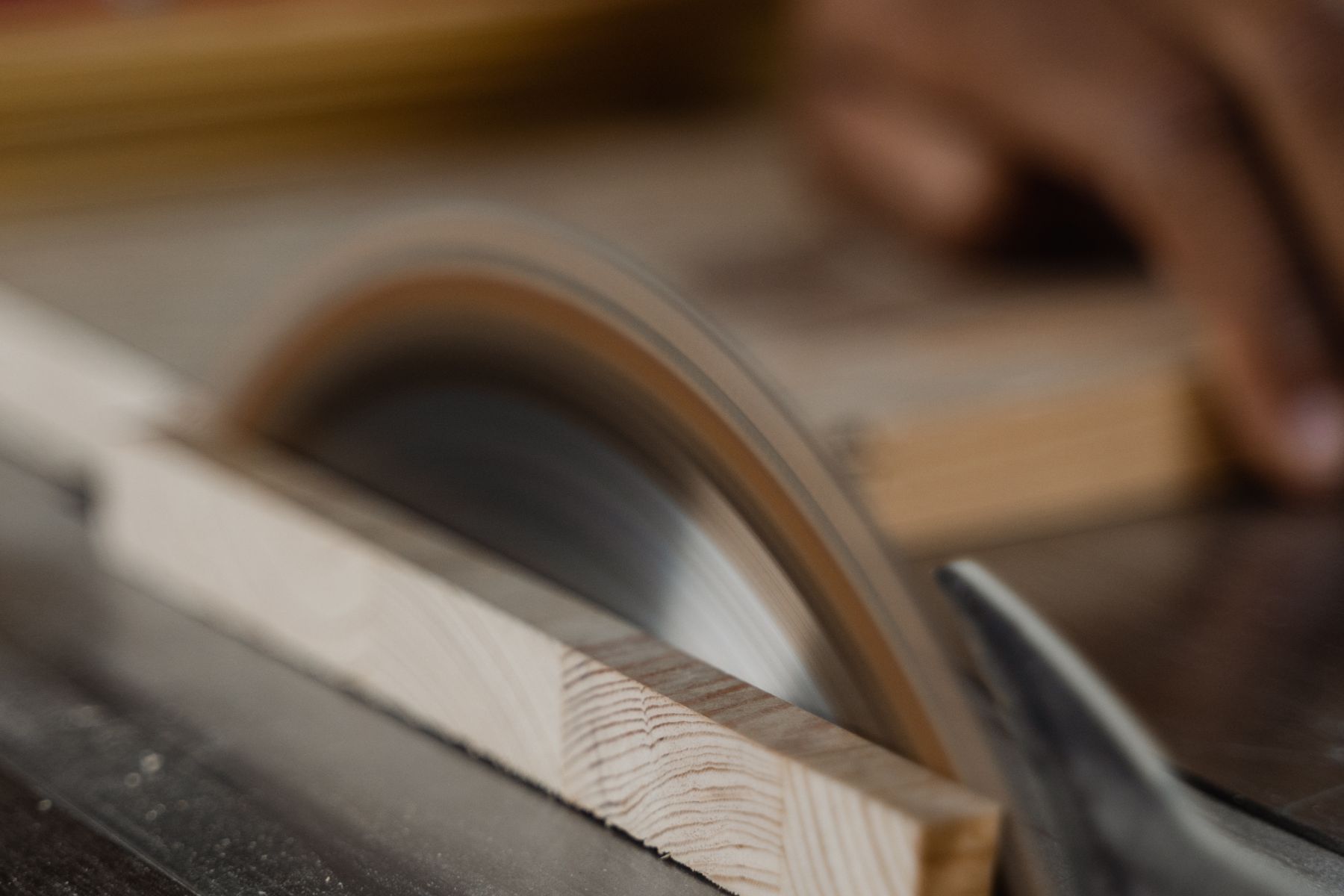 Circular saw cutting wood inside a professional workshop
