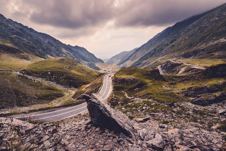 Black Car On Road Near Mountains