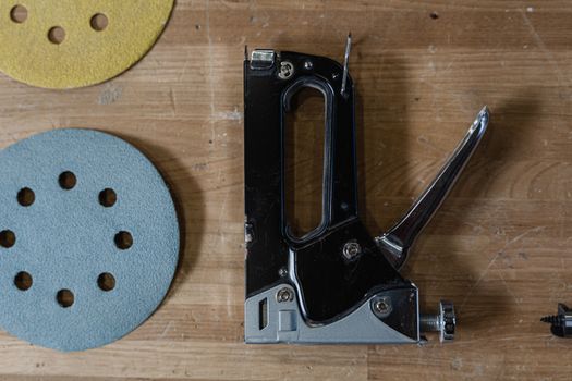 Gun Tacker on Wooden Surface