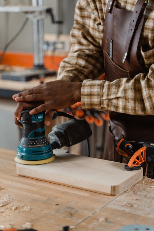 Free Person Sanding a Wood  Stock Photo
