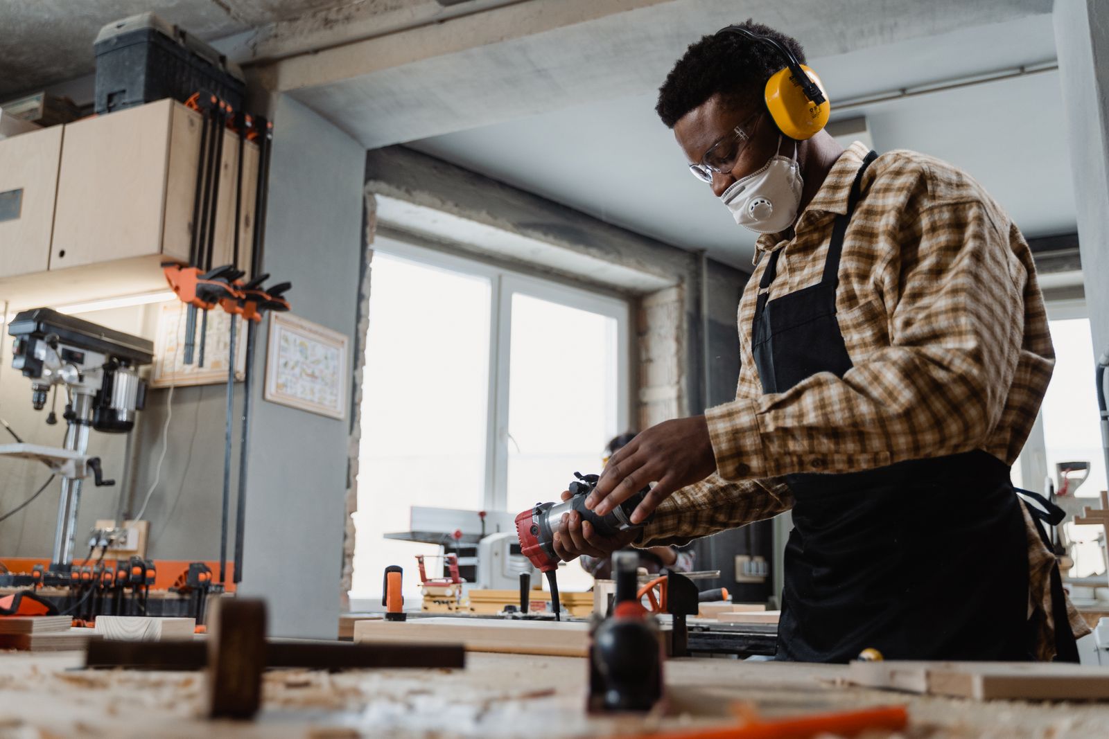 A skilled maker working carefully in a workshop