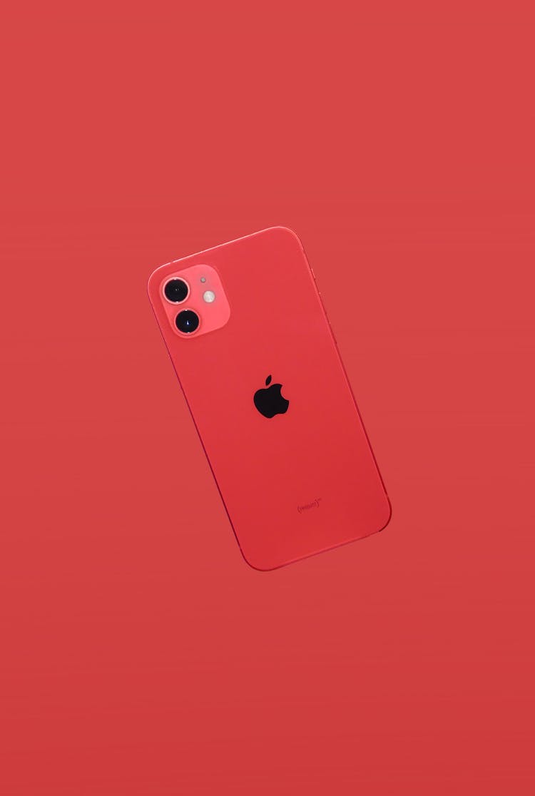 A Red IPhone On Red Background