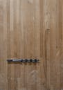 Auger Bit on Wooden Surface