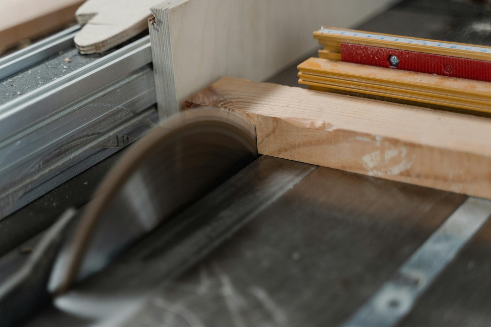 Focused image of a circular saw cutting through timber, highlighting woodworking craftsmanship.