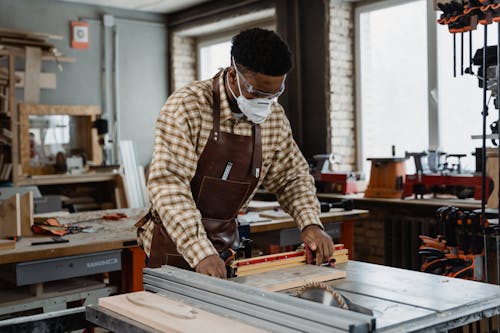 Free Photo of a Carpenter Wearing a Leather Apron Stock Photo