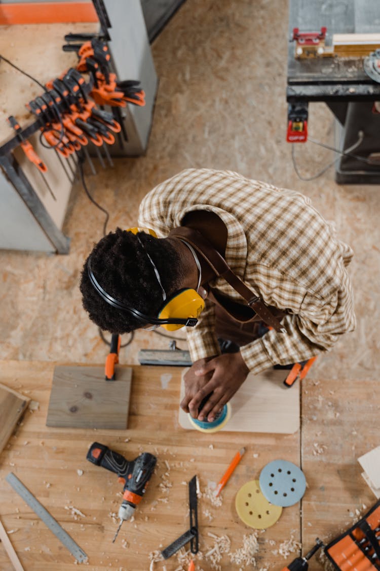 A Person Polishing Wood