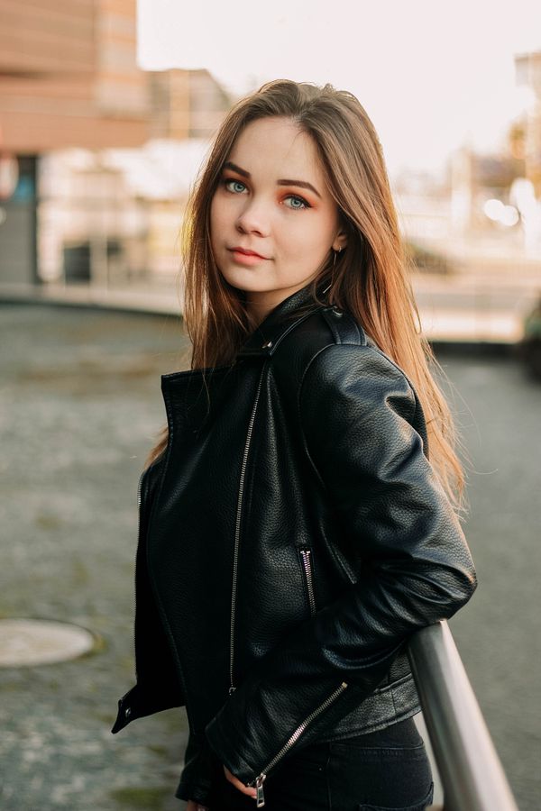 Woman in classic black leather jacket