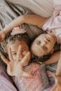 2 Girls Lying on Bed