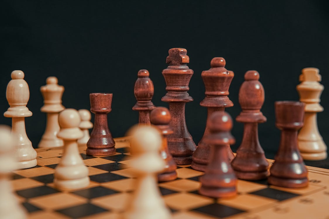 Close-Up Shot of Chess Pieces · Free Stock Photo